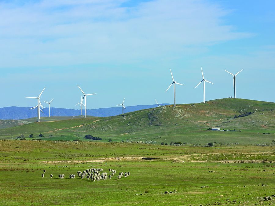 © Steven Tritton | Dreamstime.com. An array of large wind turbines moving to create kinetic energy for renewable energy supply on a cloudy day located southeast of Lake George and north of Bungendore in New South Wales, Australia 