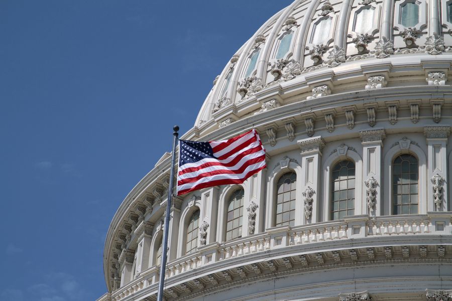 US Capitol and American flag © Splosh | Dreamstime.com