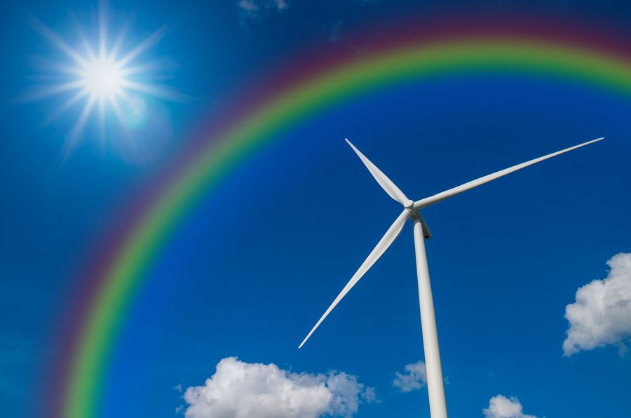 Wind turbine with rainbow on blue sky © Tzidos | Dreamstime.com
